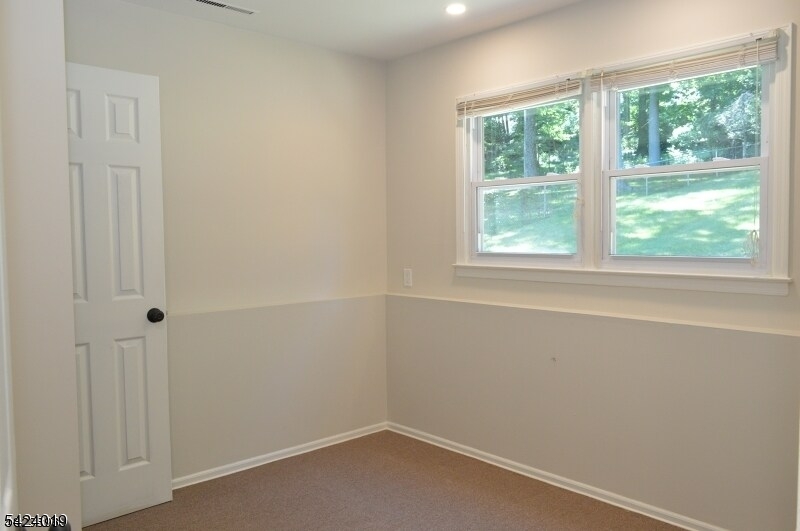 89 Forsythia Lane, Unit A Paramus, NJ 07652 - Photo 10 of 12 an empty room with a window