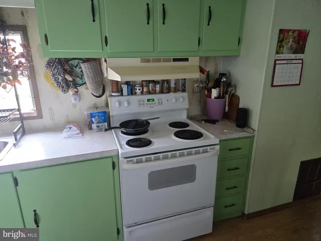 a kitchen with a stove and a sink