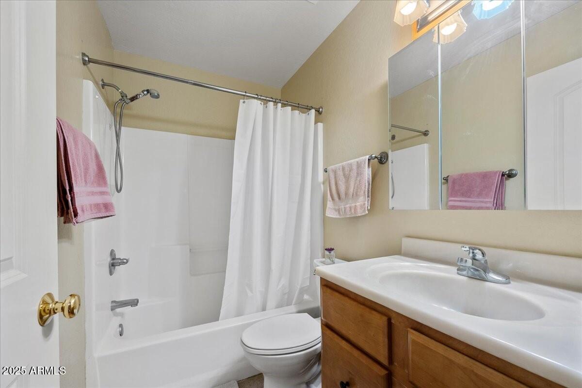 4580 East Steven Way Rimrock, AZ 86335 - Photo 14 of 17 a bathroom with a granite countertop sink toilet and shower