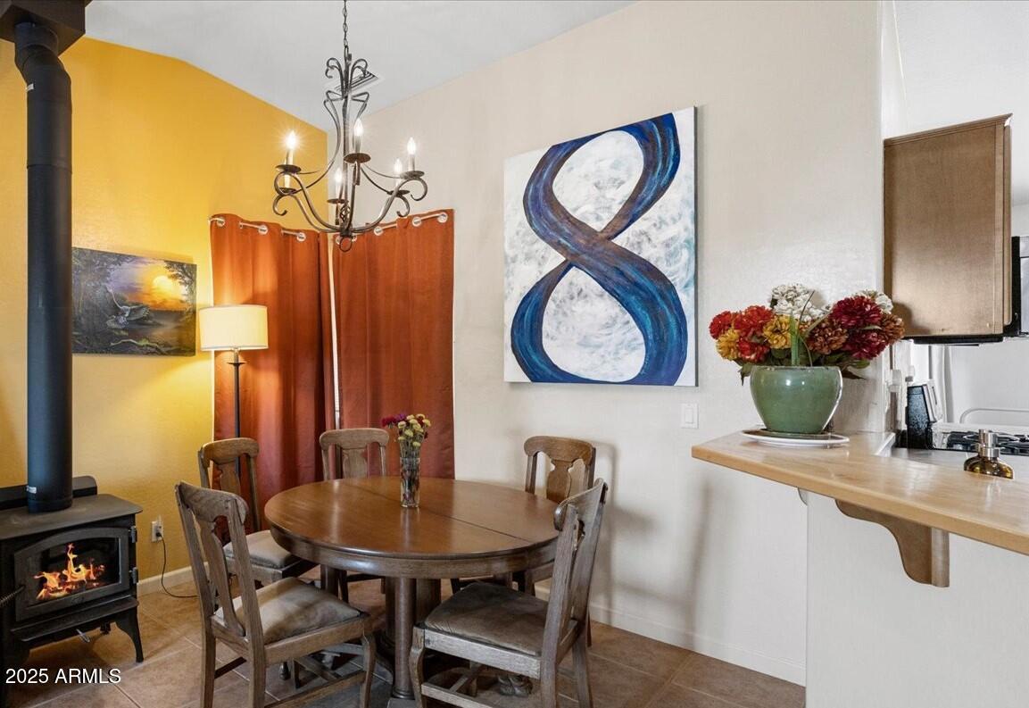 4580 East Steven Way Rimrock, AZ 86335 - Photo 5 of 17 a view of a dining room with furniture and a chandelier