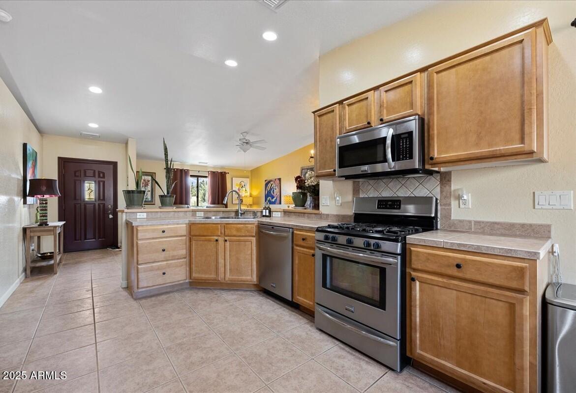 4580 East Steven Way Rimrock, AZ 86335 - Photo 7 of 17 a kitchen with stainless steel appliances granite countertop a stove and a sink