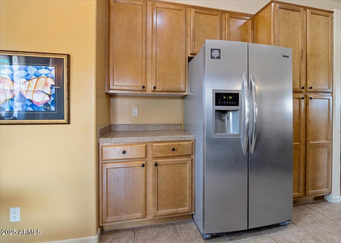 4580 East Steven Way Rimrock, AZ 86335 - Photo 8 of 17 a close view of a refrigerator in kitchen with stainless steel appliances wooden floor