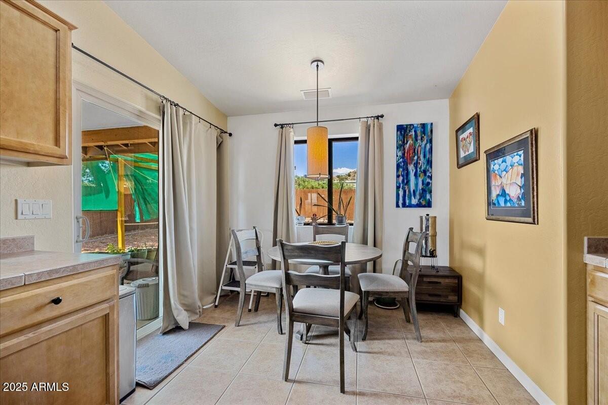 4580 East Steven Way Rimrock, AZ 86335 - Photo 9 of 17 a living room with furniture a window and a flat screen tv