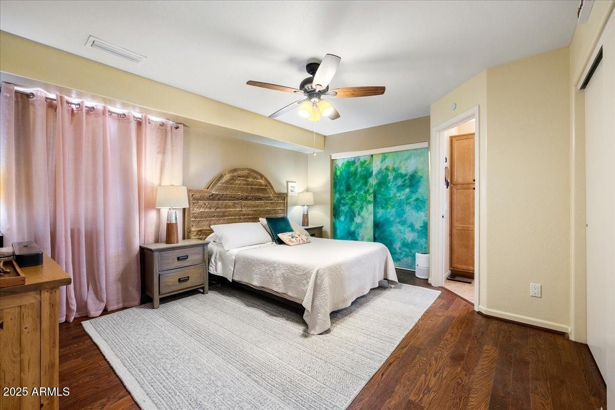 4580 East Steven Way Rimrock, AZ 86335 - Photo 10 of 17 a bed room with a bed and a chandelier