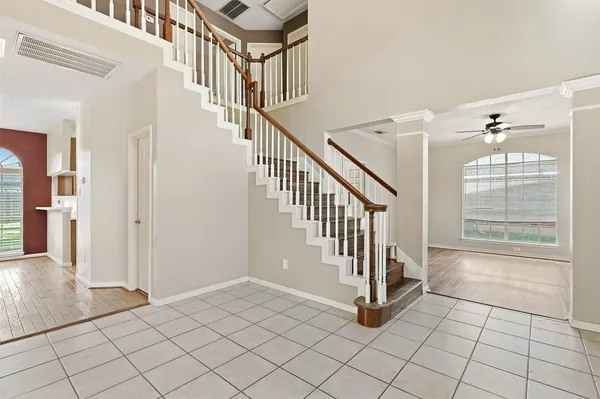 a view of an entryway with wooden floor