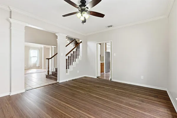 a view of an entryway with wooden floor