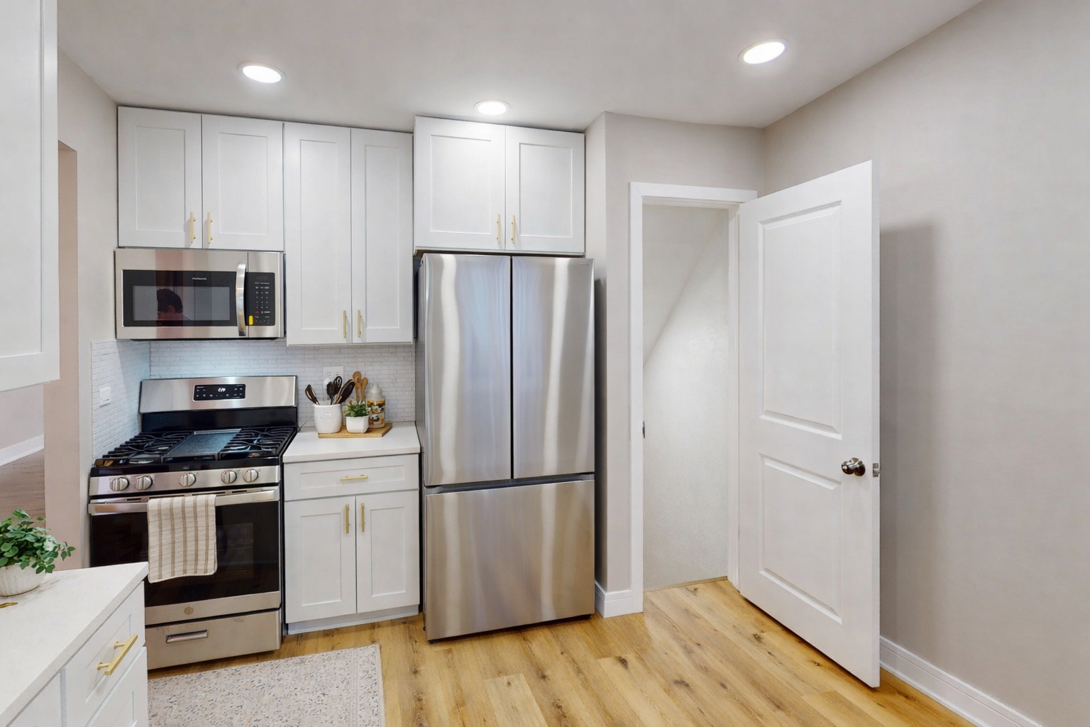 1321 Pitner Avenue, Unit A Evanston, IL 60201 - Photo 11 of 35 a kitchen with a refrigerator stove and wooden cabinets