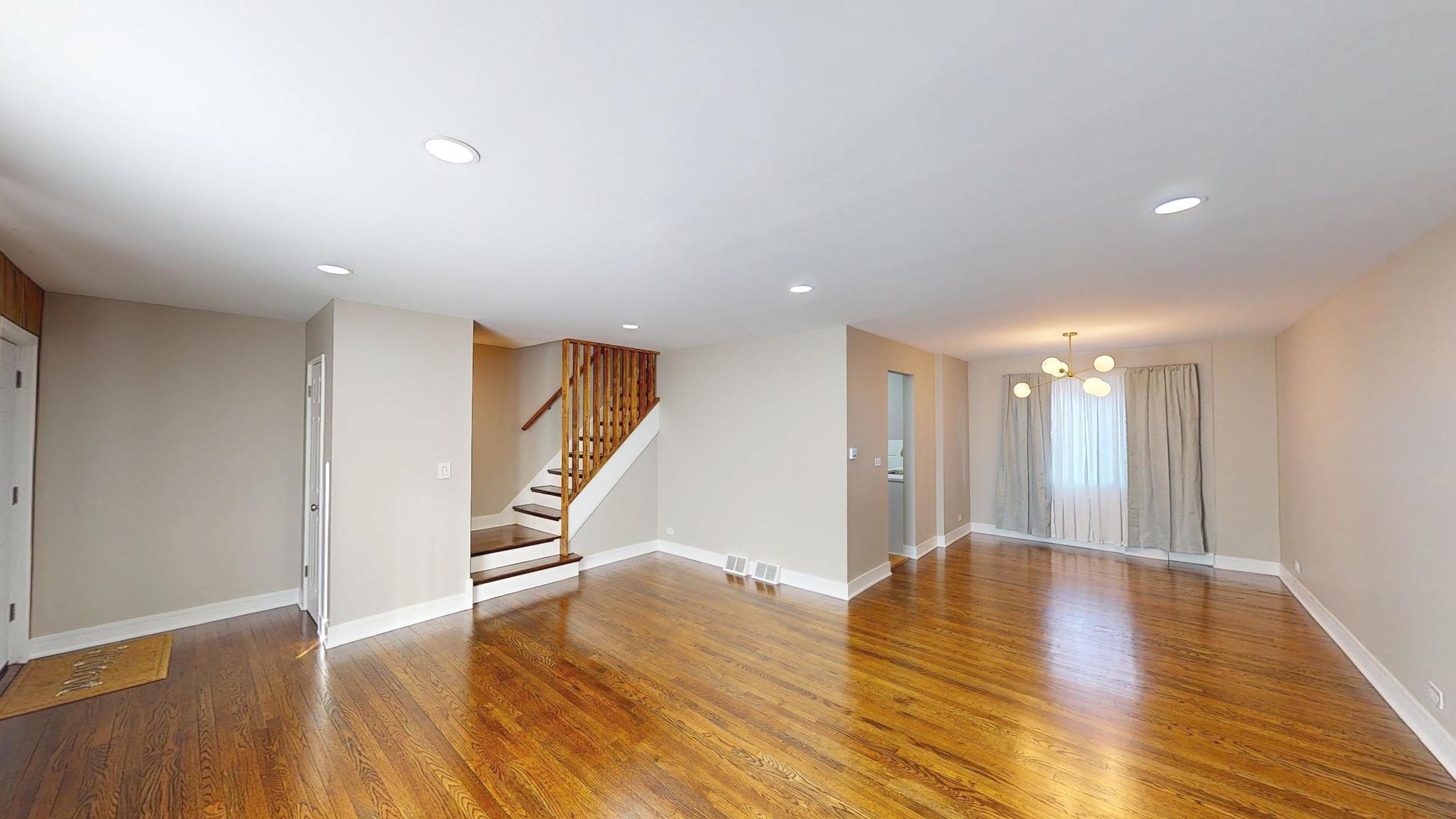 1321 Pitner Avenue, Unit A Evanston, IL 60201 - Photo 4 of 35 a view of an empty room with wooden floor