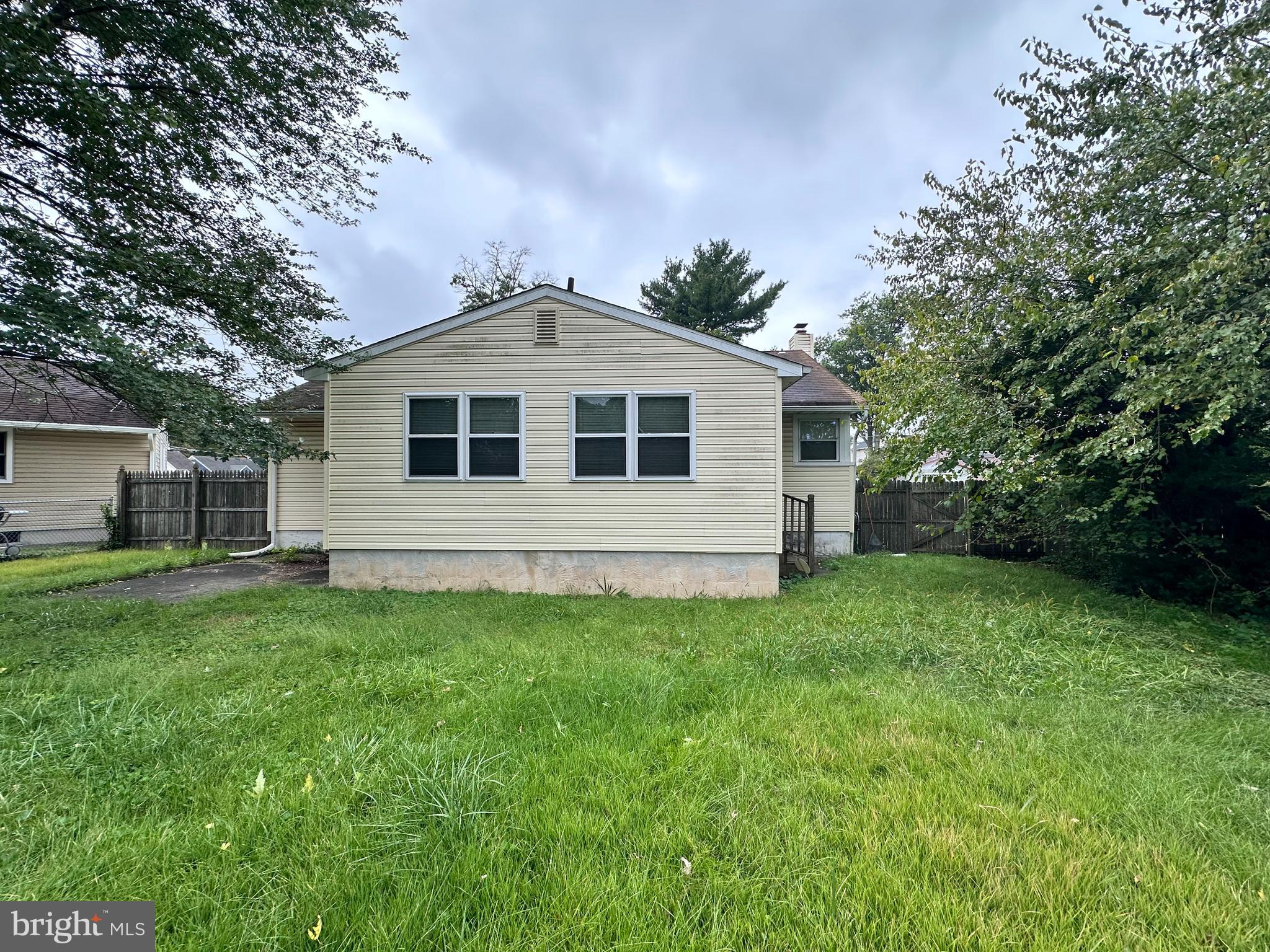 115 Gloucester Avenue Magnolia, NJ 08049 - Photo 2 of 2 a front view of a house with a yard