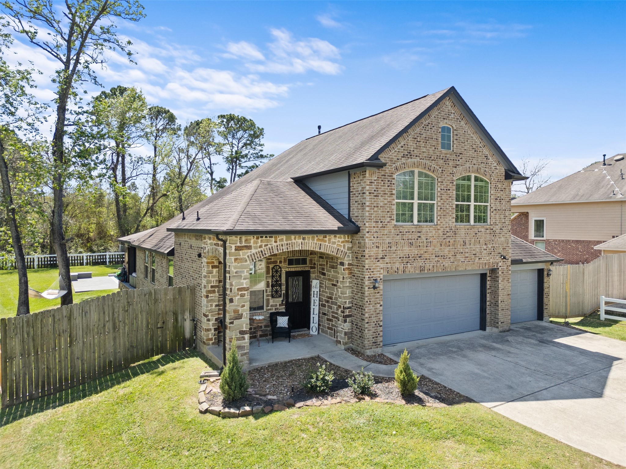 7927 Needlepoint Road Baytown, TX 77521 - Photo 1 of 46 a front view of a house with garden