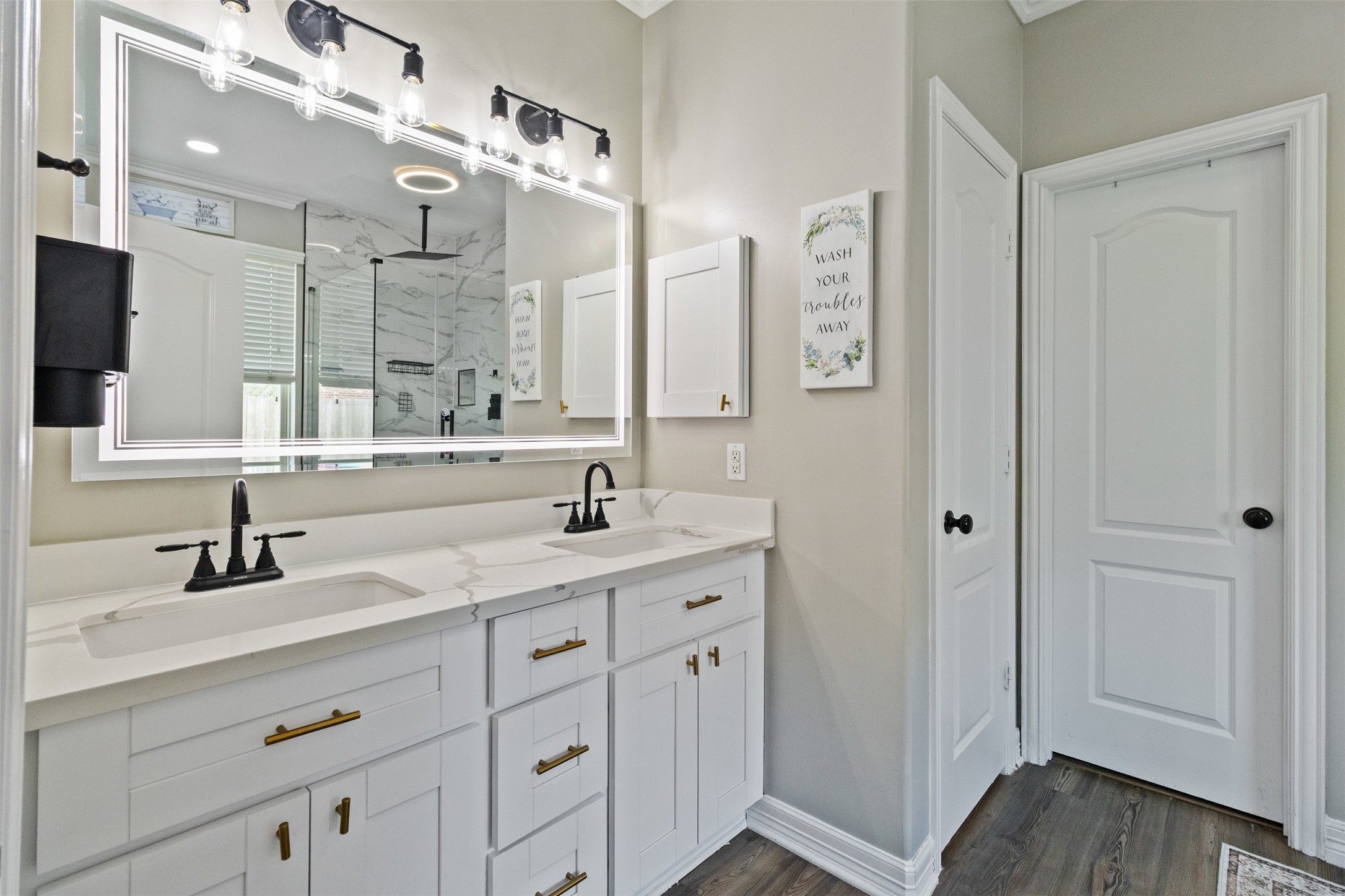 7927 Needlepoint Road Baytown, TX 77521 - Photo 18 of 46 a bathroom with a sink double vanity and a mirror