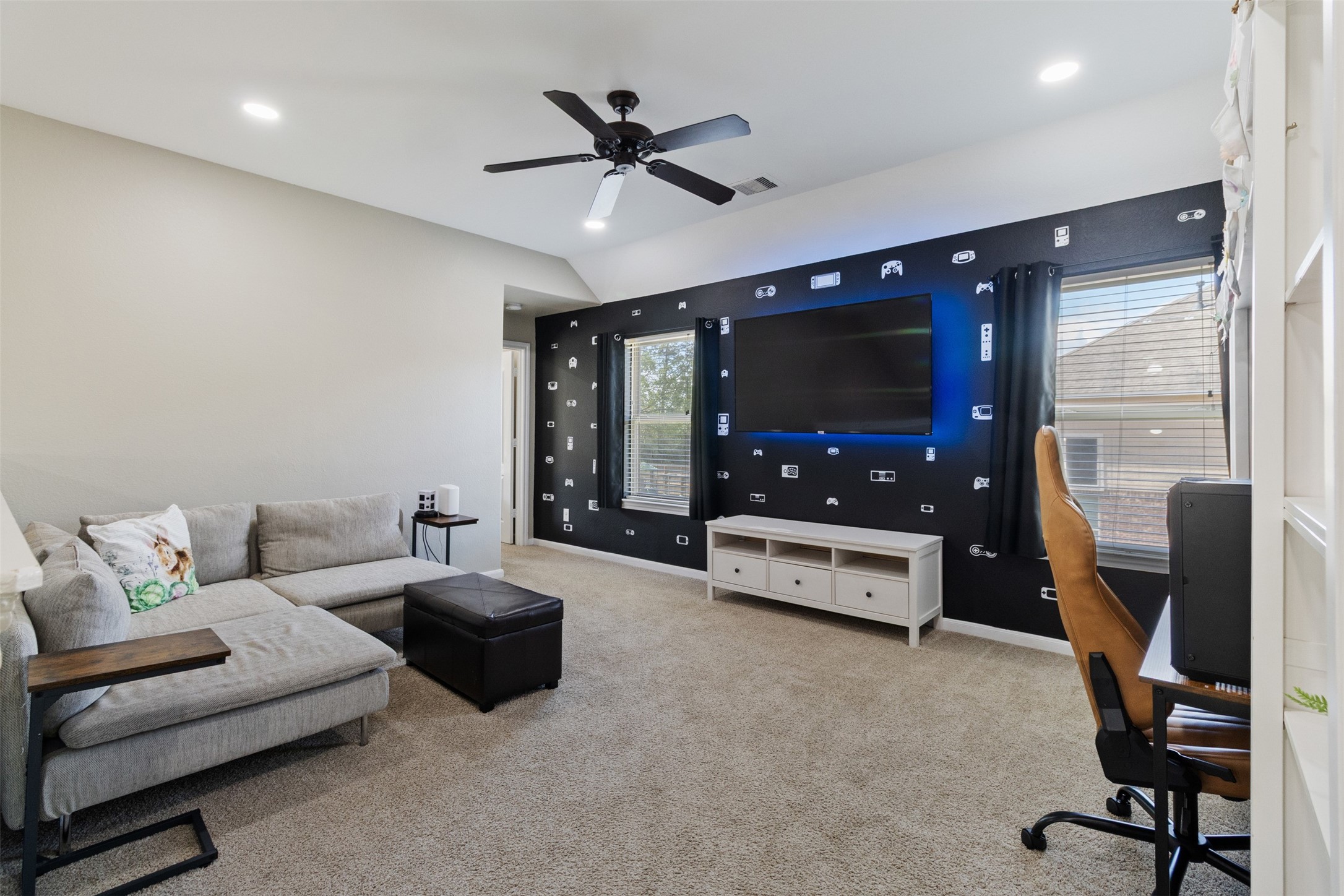 7927 Needlepoint Road Baytown, TX 77521 - Photo 25 of 46 a living room with furniture and a flat screen tv