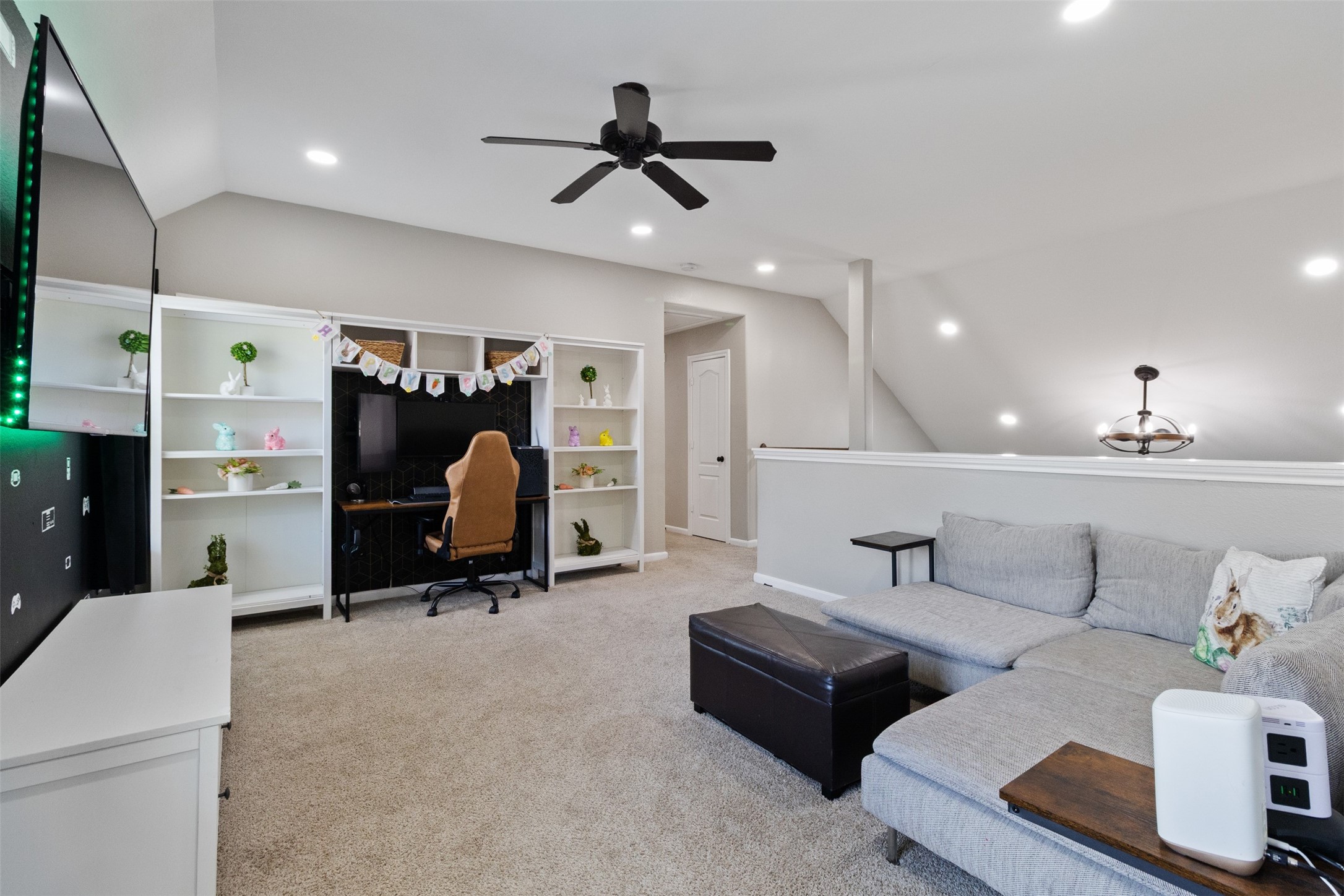 7927 Needlepoint Road Baytown, TX 77521 - Photo 26 of 46 a living room with furniture and a gym machine
