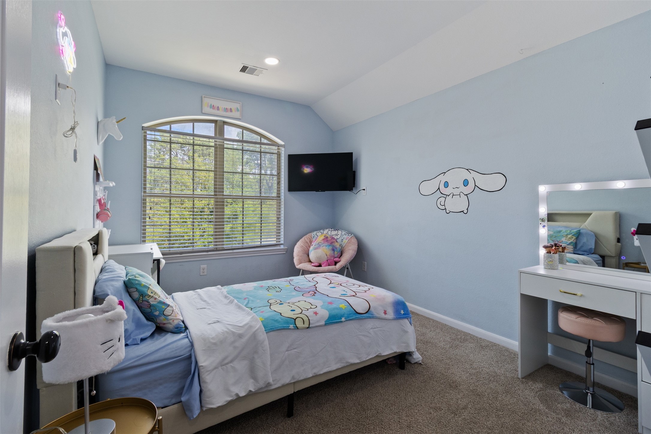 7927 Needlepoint Road Baytown, TX 77521 - Photo 27 of 46 a bedroom with a bed and a flat screen tv