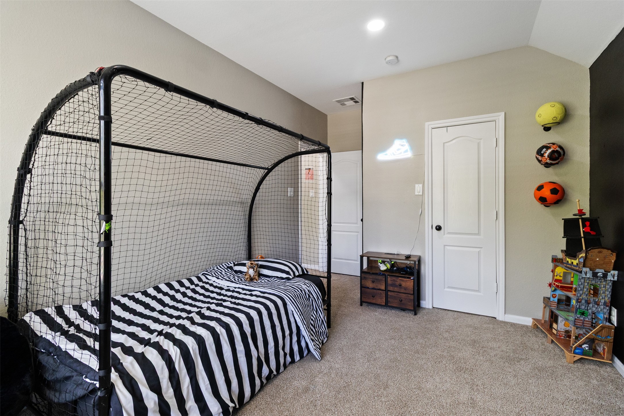7927 Needlepoint Road Baytown, TX 77521 - Photo 29 of 46 a bedroom with a bed and a closet