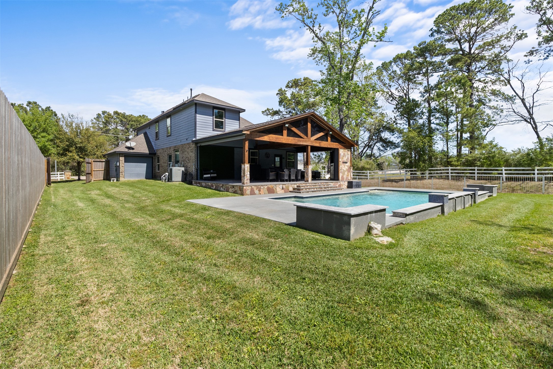 7927 Needlepoint Road Baytown, TX 77521 - Photo 40 of 46 a front view of a house with swimming pool and porch