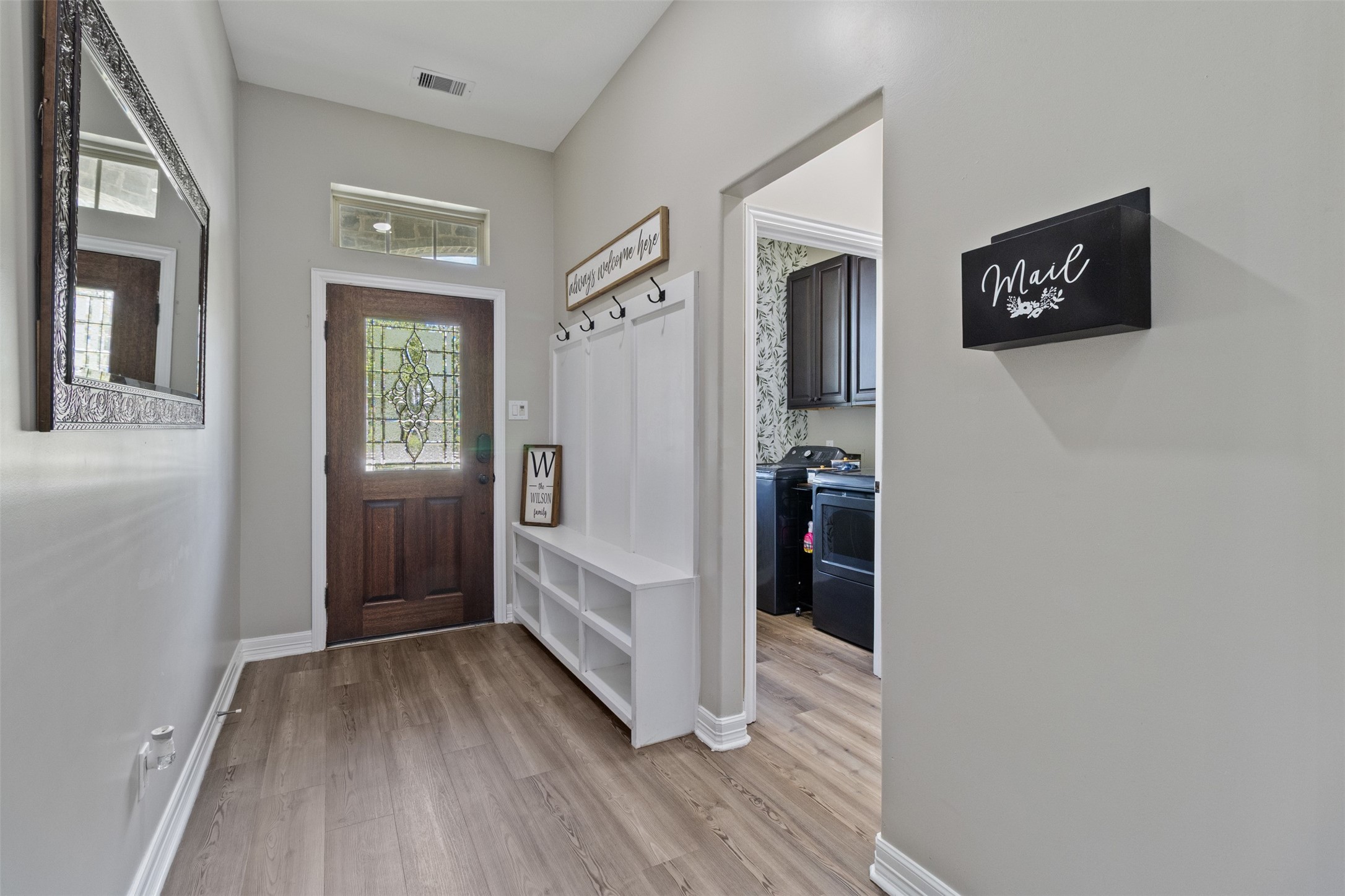 7927 Needlepoint Road Baytown, TX 77521 - Photo 4 of 46 a view of hallway with wooden floor and stairs