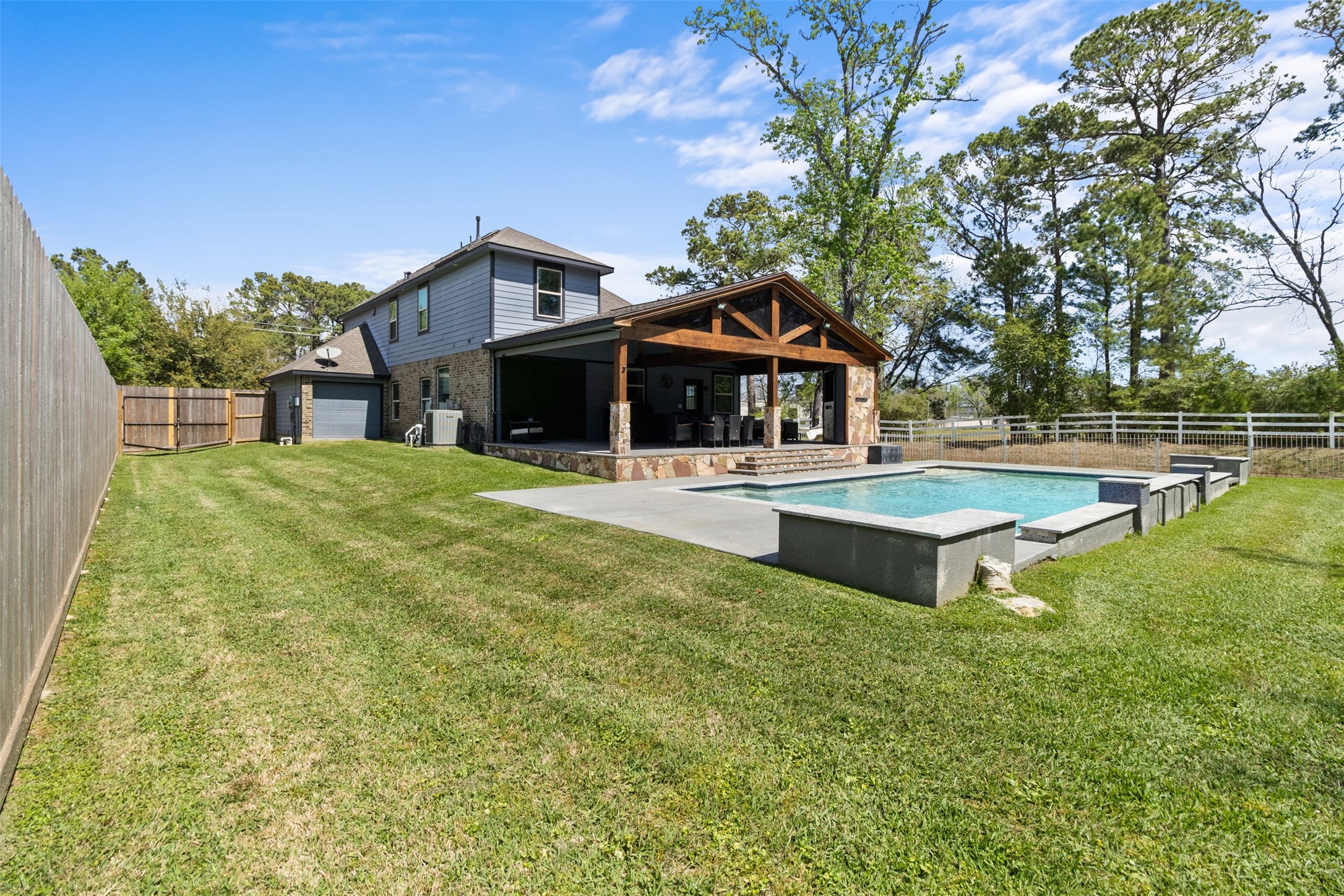 7927 Needlepoint Road Baytown, TX 77521 - Photo 42 of 46 a front view of a house with swimming pool and view of a house