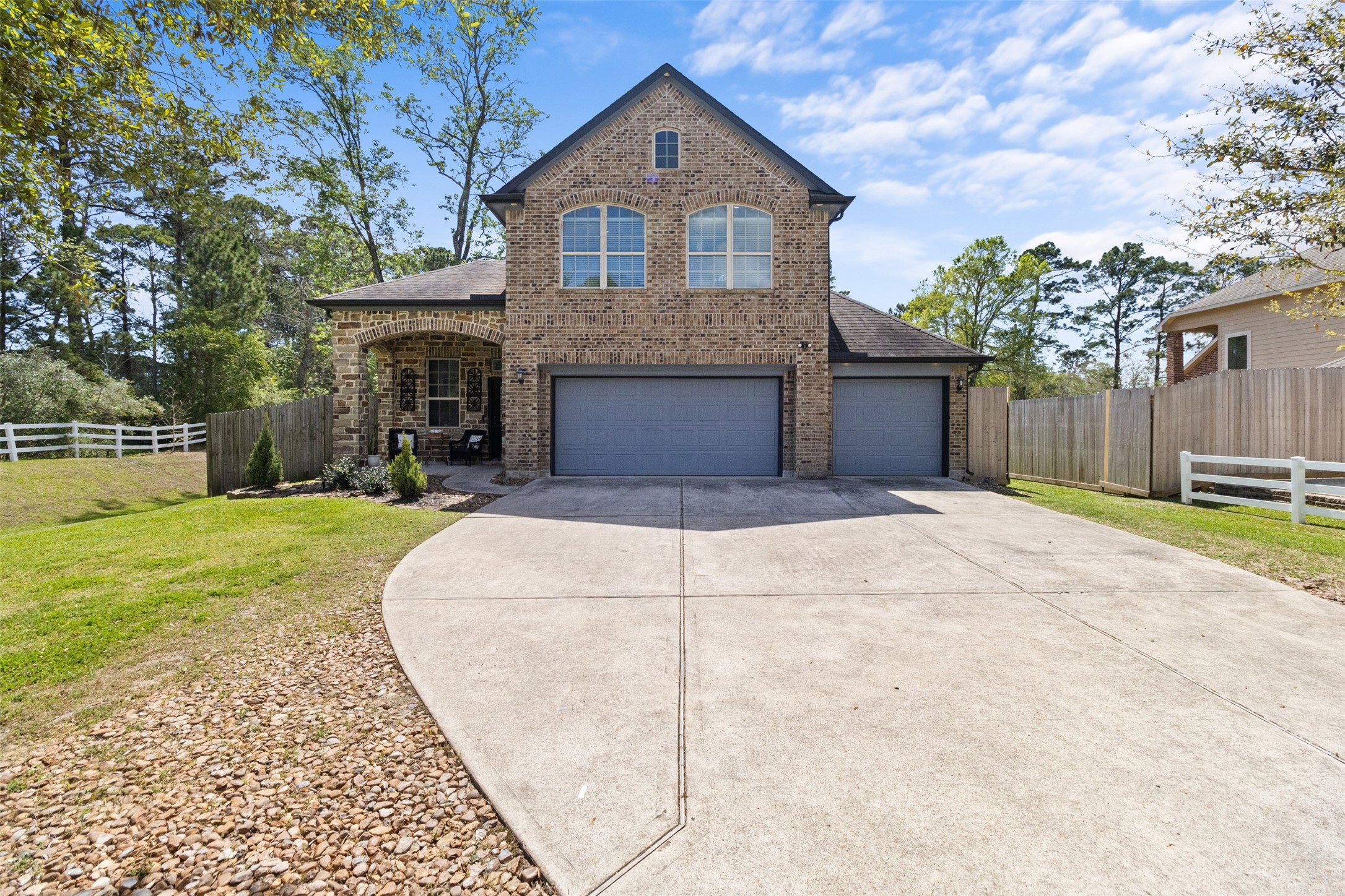 7927 Needlepoint Road Baytown, TX 77521 - Photo 43 of 46 a front view of a house with a yard and garage