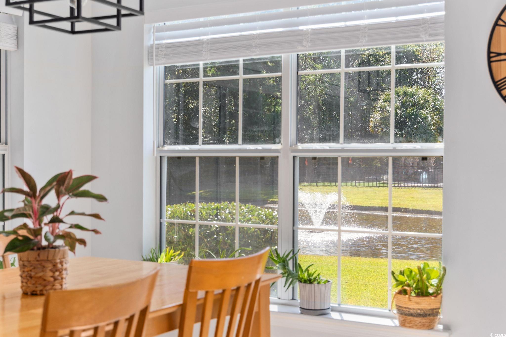 1409 Lanterns Rest Road Myrtle Beach, SC 29579 - Photo 8 of 40 Dining room featuring a water view and a chandelier