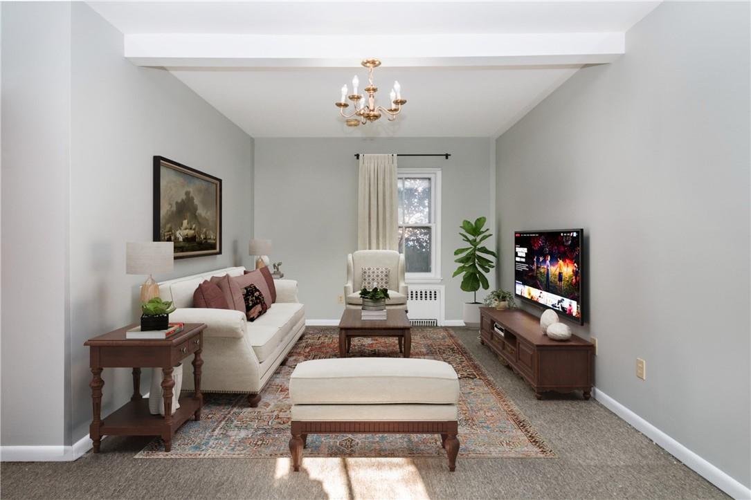 274 Lockwood Avenue, Unit FIRST New Rochelle, NY 10801 - Photo 1 of 1 a living room with furniture a chandelier and a window