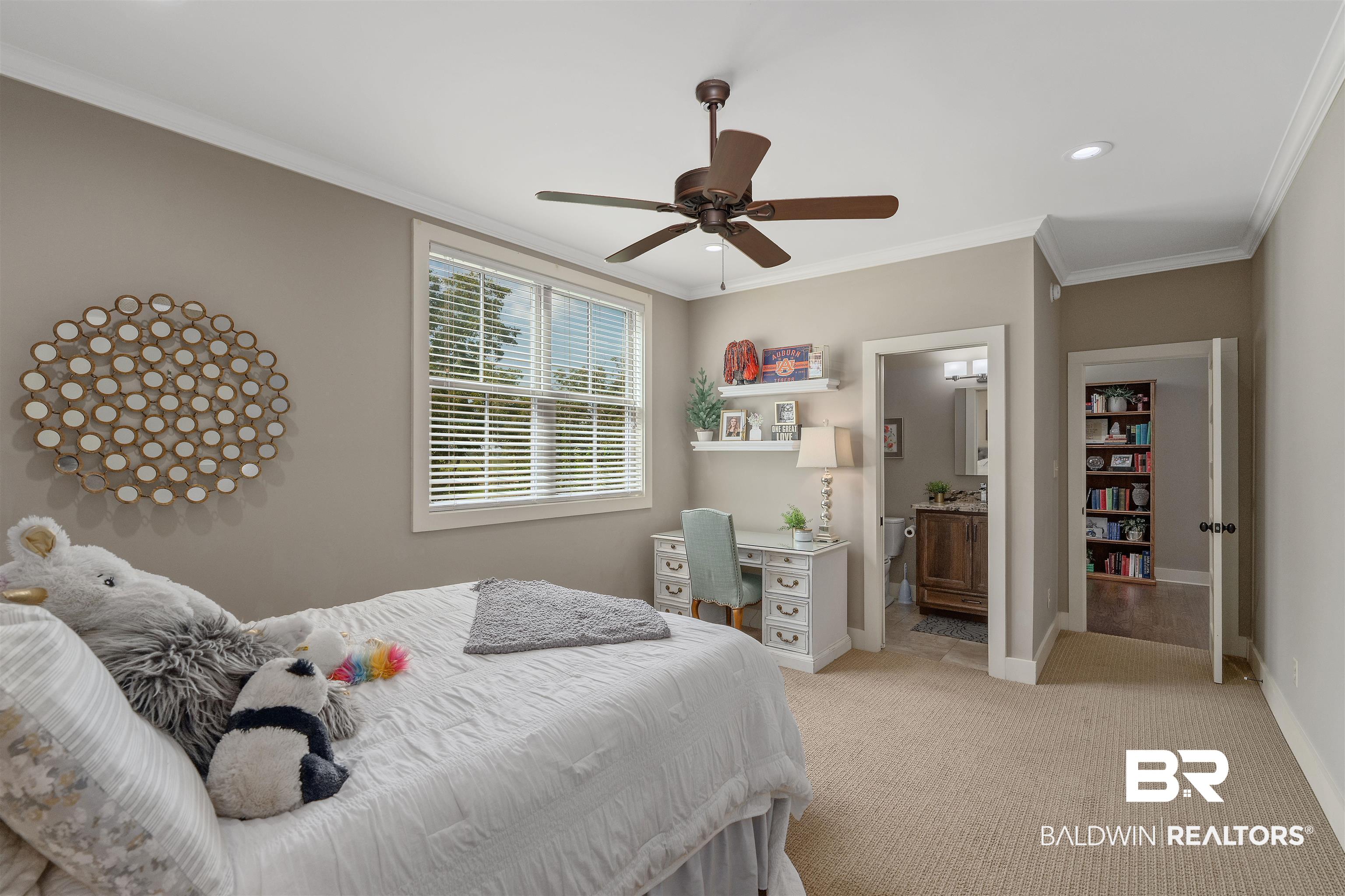 8753 Bishop Road Fairhope, AL 36532 - Photo 33 of 59 Spacious room featuring neutral carpeting, a large window with blinds, and crown molding