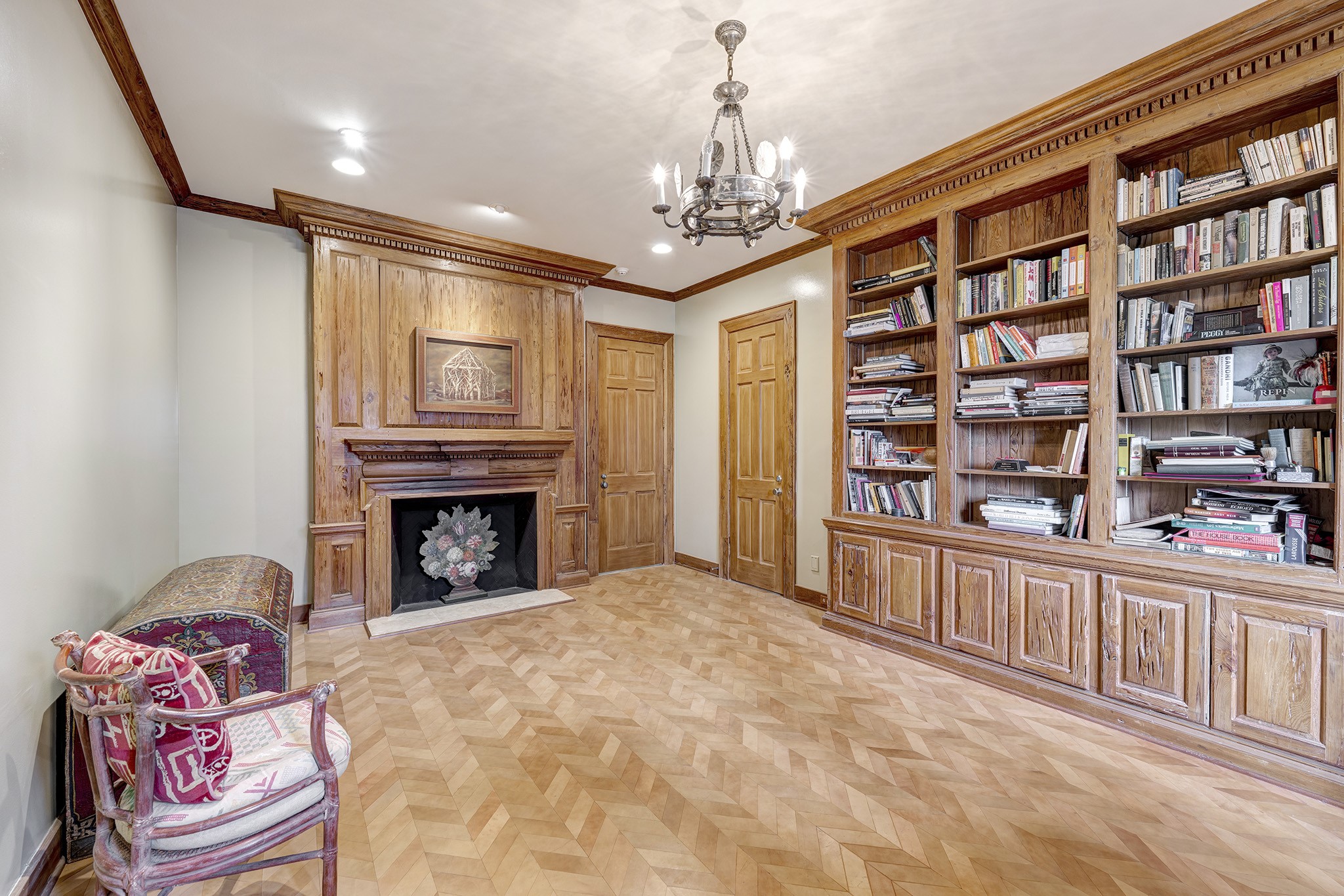 3653 Inverness Drive Houston, TX 77019 - Photo 27 of 39 Bedroom three is currently being used as a study. It offers a full bathroom, walk-in closet, leathered chevron flooring, a "Pecky Cypress" reclaimed bookcase, mantle surround, and a mock fireplace.