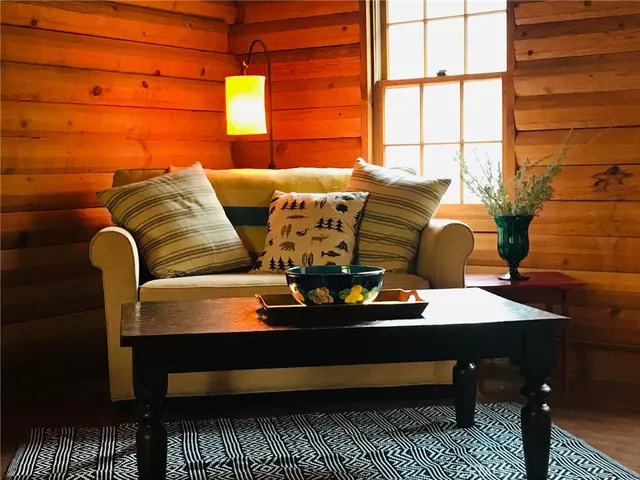 a view of balcony with wooden floor and outdoor seating