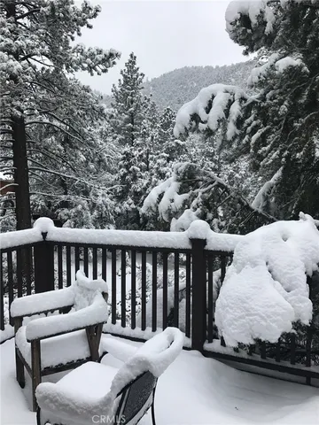 a kitchen with a table chairs and a stove