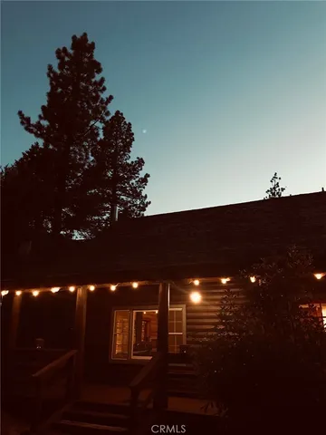 a view of a dining room with furniture and window