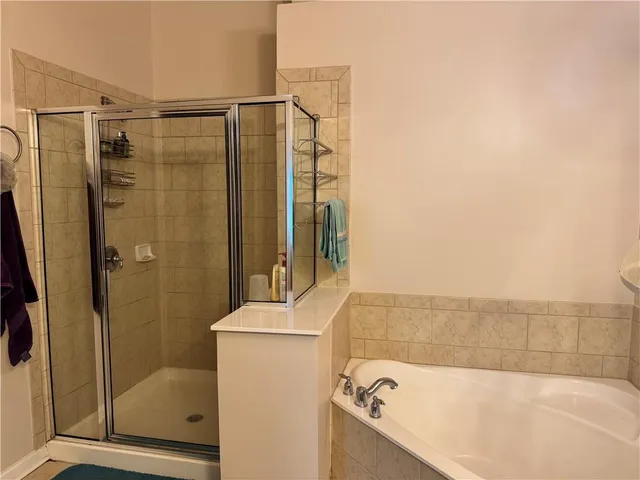 a bathroom with a sink vanity and mirror