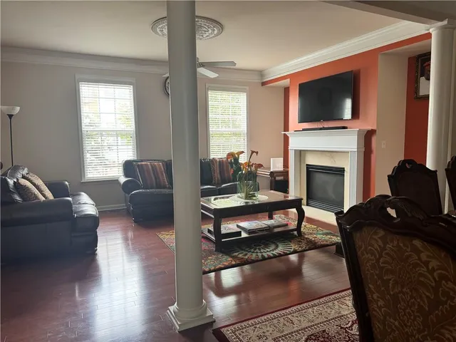 a view of a dining room with furniture and wooden floor