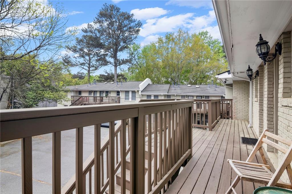 1879 Johnson Road Northeast, Unit 5 Atlanta, GA 30306 - Photo 25 of 28 a balcony with wooden floor and outdoor space