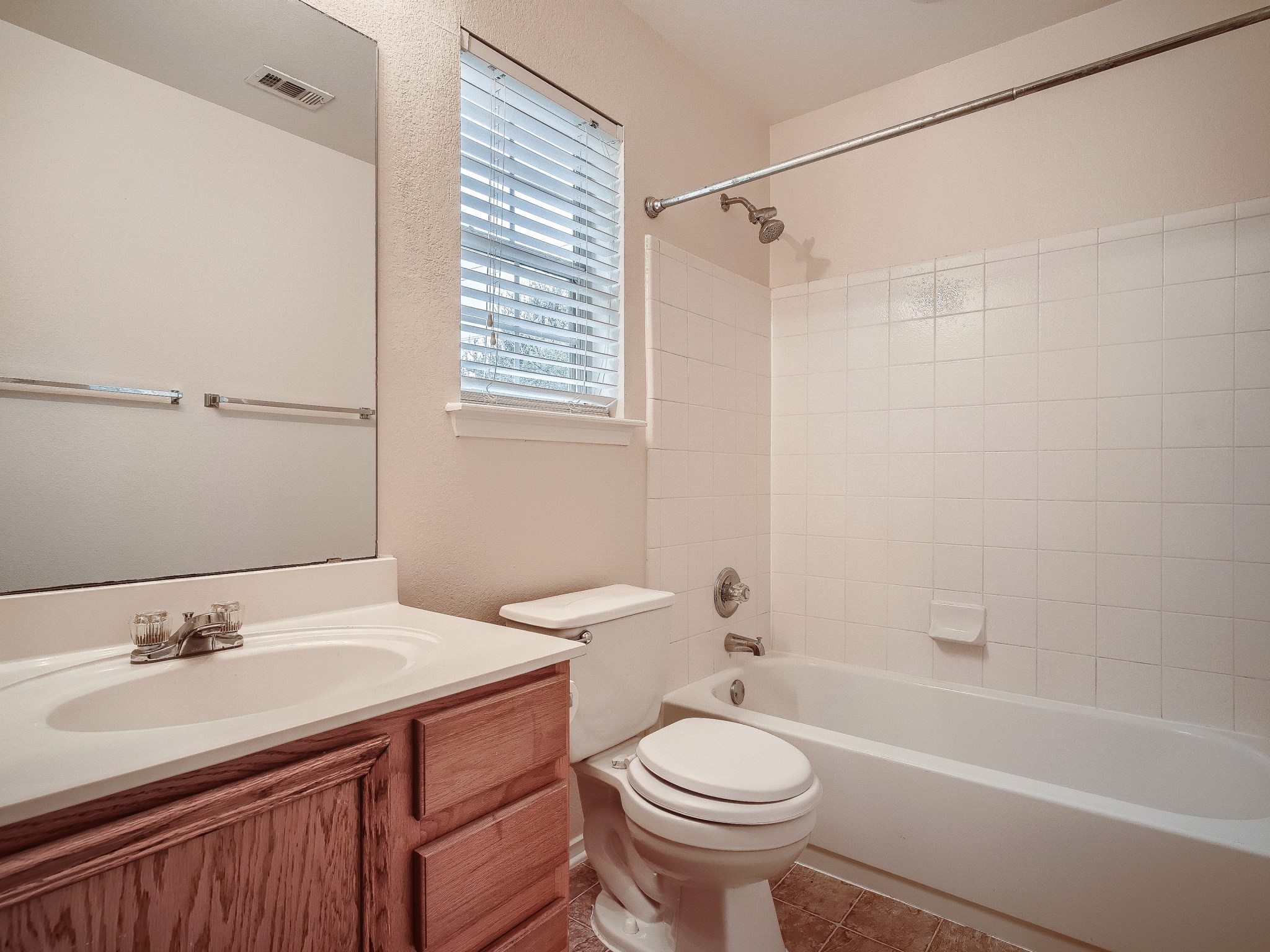2002 Nogales Trail Austin, TX 78744 - Photo 12 of 16 a bathroom with a sink a toilet and a bathtub