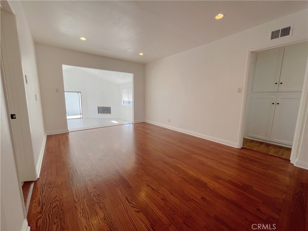 15100 Dunton Drive Whittier, CA 90604 - Photo 4 of 17 wooden floor in an empty room with a window