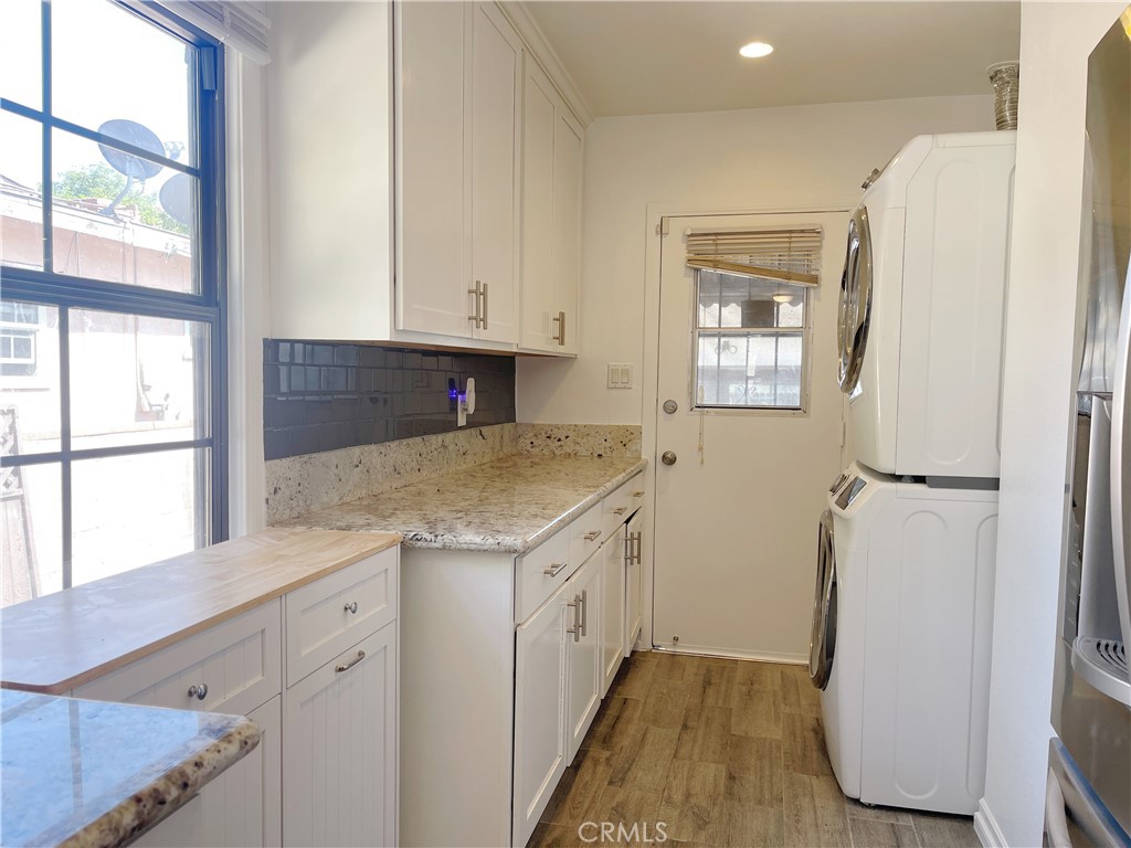 15100 Dunton Drive Whittier, CA 90604 - Photo 7 of 17 a view of a kitchen with a sink and dishwasher