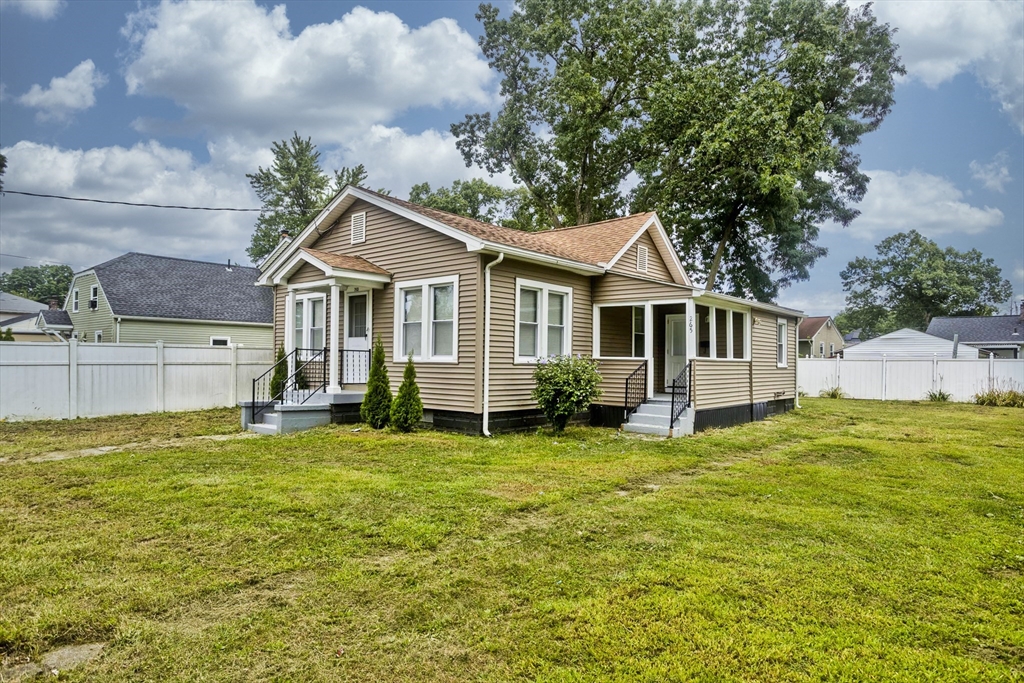 a front view of a house with a yard