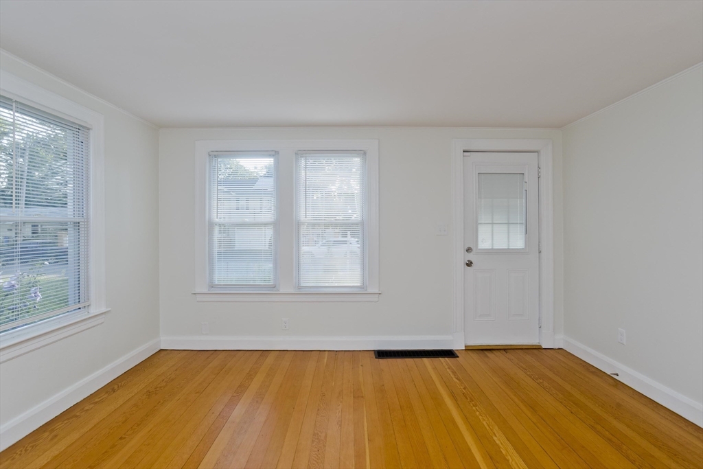265 Ambrose Street Springfield, MA 01109 - Photo 16 of 24 wooden floor in an empty room with a window