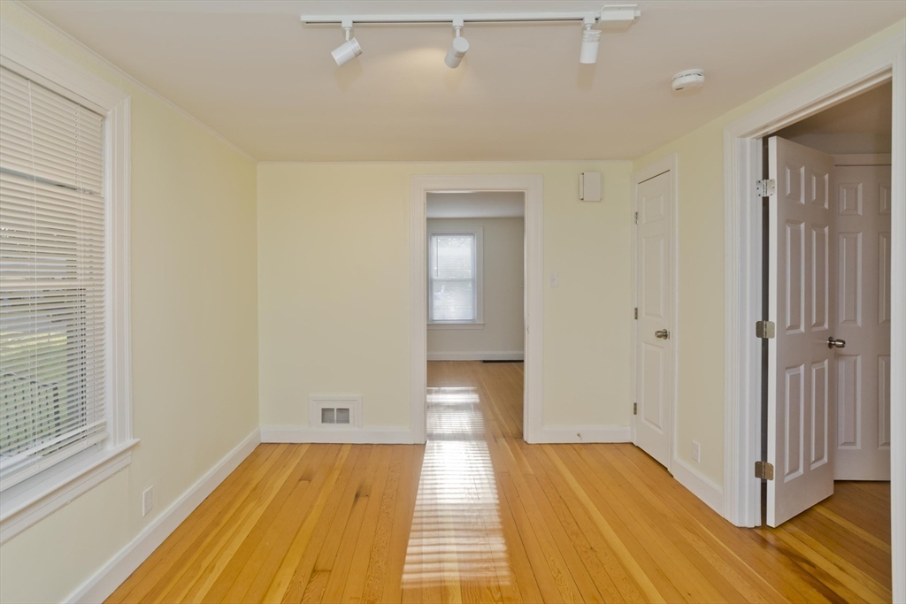 265 Ambrose Street Springfield, MA 01109 - Photo 19 of 24 a view of a room with wooden floor and bathroom