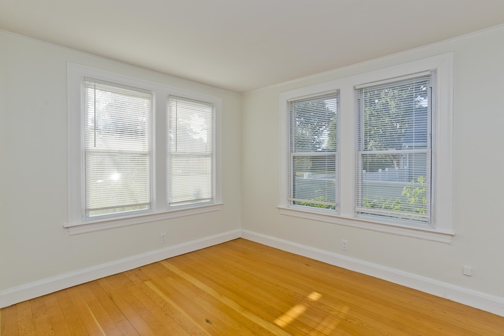 265 Ambrose Street Springfield, MA 01109 - Photo 6 of 24 a view of an empty room with a window