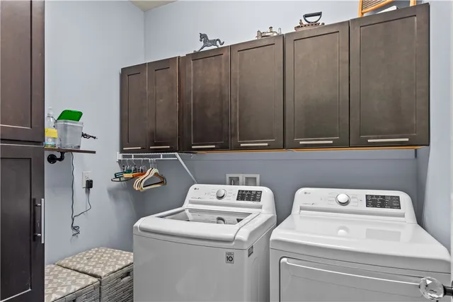 a living room with fireplace furniture and a flat screen tv