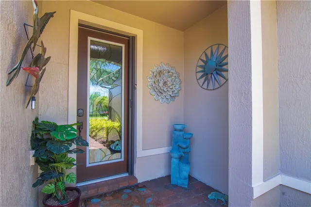 a view of entryway with paintings on the wall