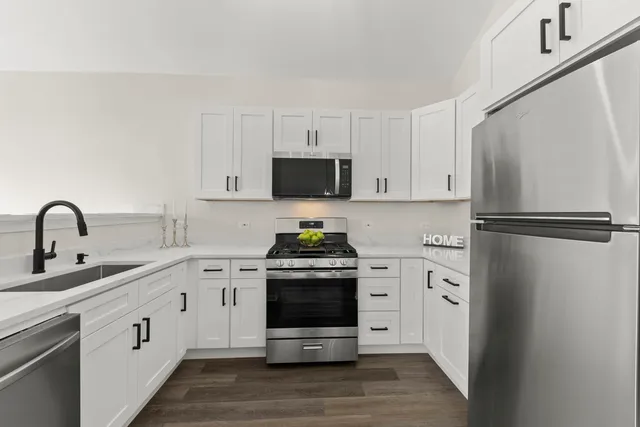 a kitchen with a stove and a refrigerator