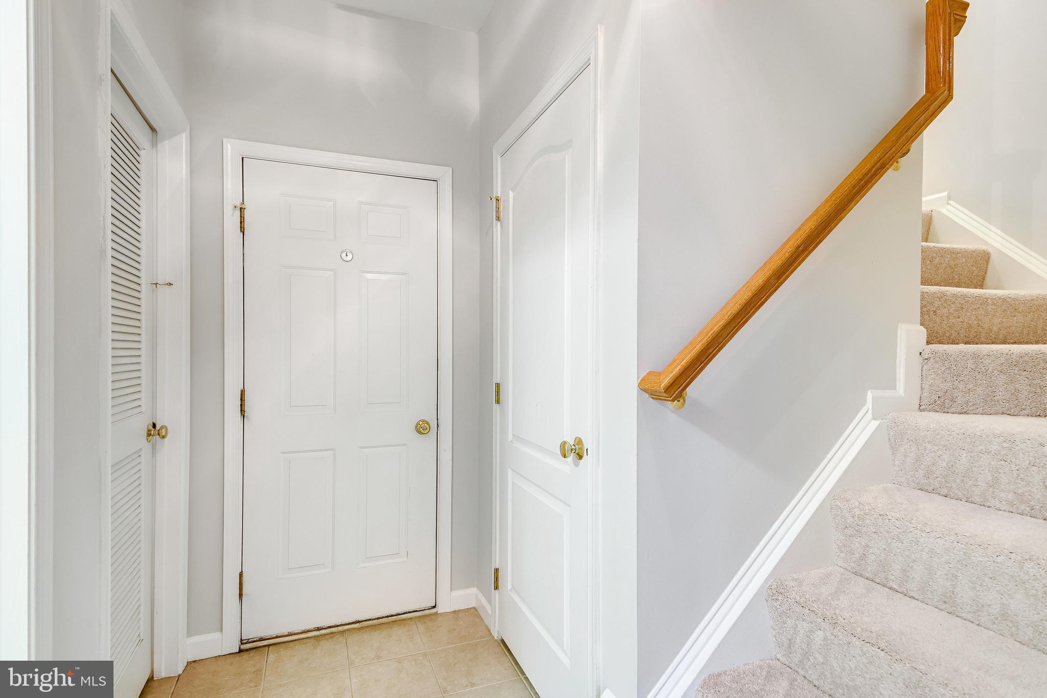 25374 McIntyre Square Chantilly, VA 20152 - Photo 25 of 32 Lower Level Garage Entry plus Ceramic Tiling