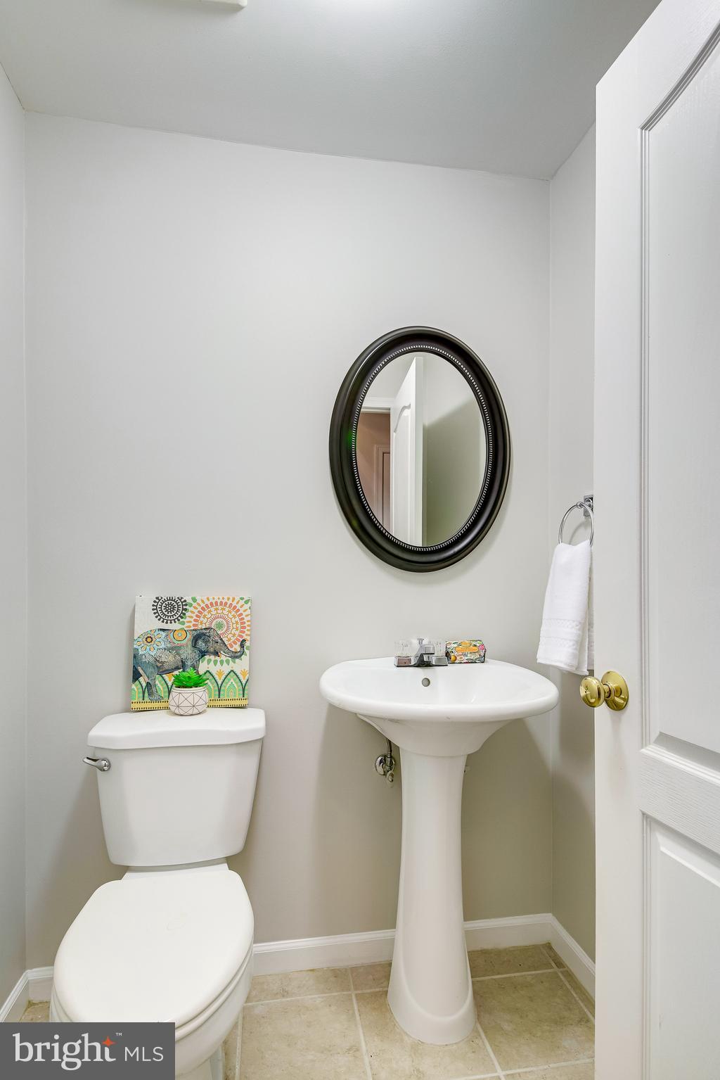 25374 McIntyre Square Chantilly, VA 20152 - Photo 28 of 32 Lower Level Half Bath with Pedestal Sink