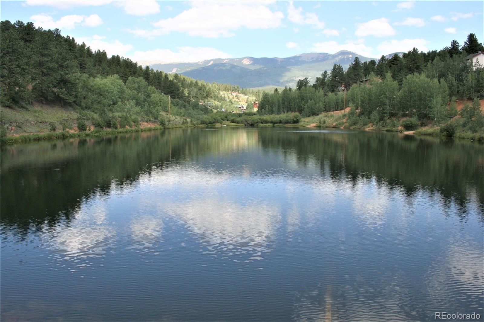 Wolf Road Bailey, CO 80421 - Photo 24 of 26 a view of a lake with a city
