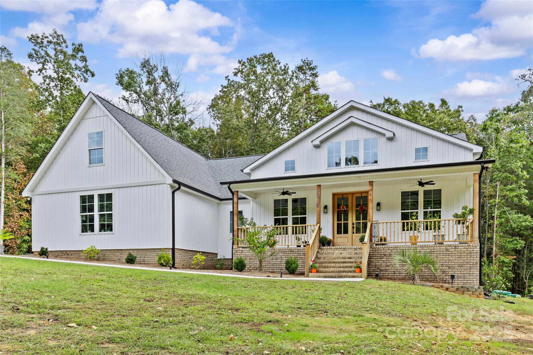 a front view of a house with a yard