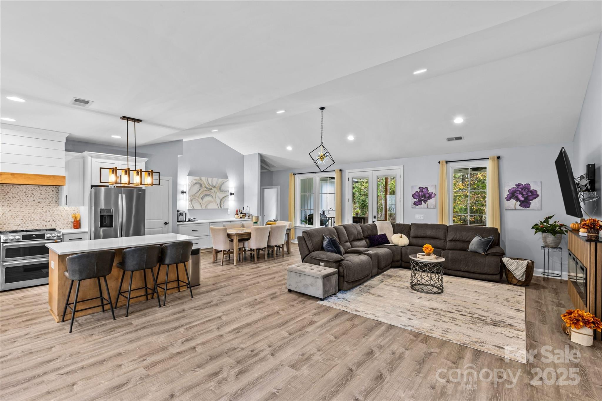 4815 Chadwick Drive Concord, NC 28025 - Photo 12 of 42 a living room with lots of furniture and a wooden floor