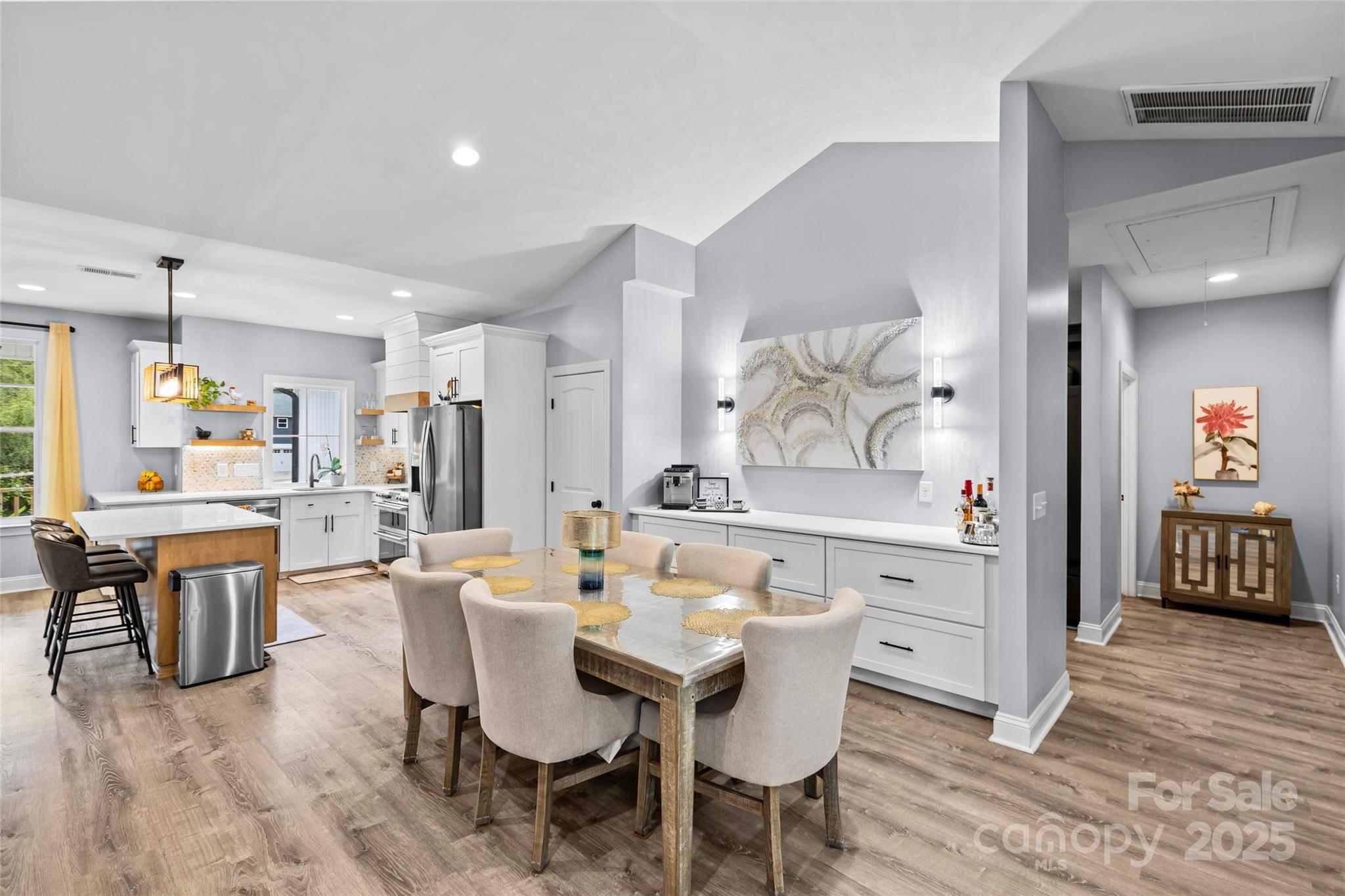 4815 Chadwick Drive Concord, NC 28025 - Photo 13 of 42 a view of a dining room with furniture and wooden floor