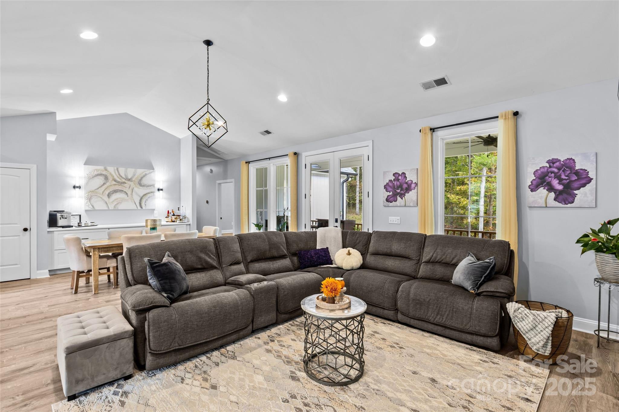 4815 Chadwick Drive Concord, NC 28025 - Photo 17 of 42 a living room with furniture and a chandelier